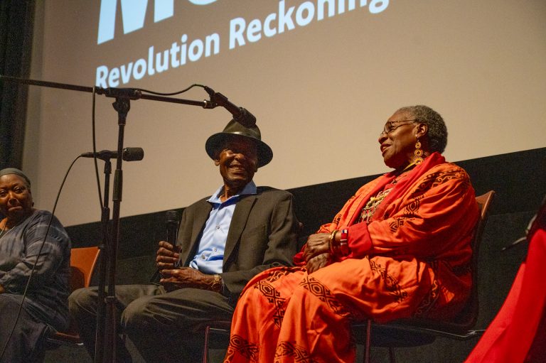 Almeta Whitis and Joe Beard on stage at an event